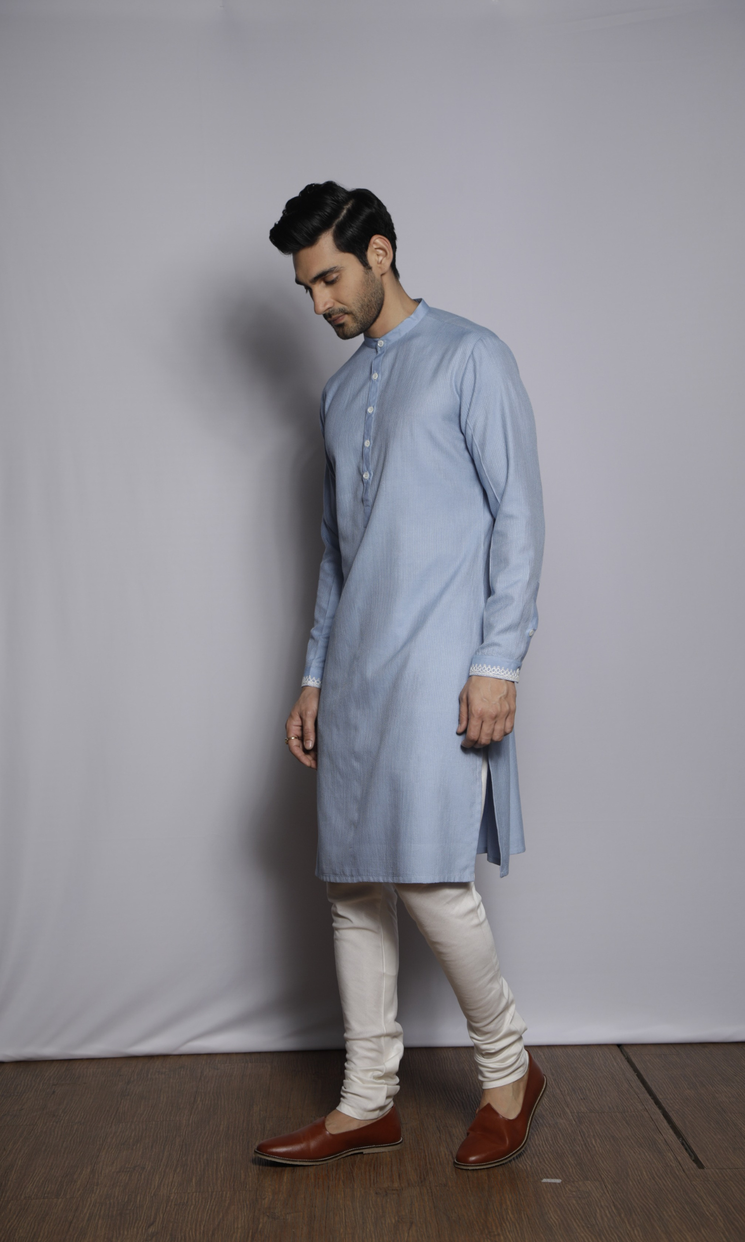 Powder blue kurta with front and sleeves self threading and emb on cuffs