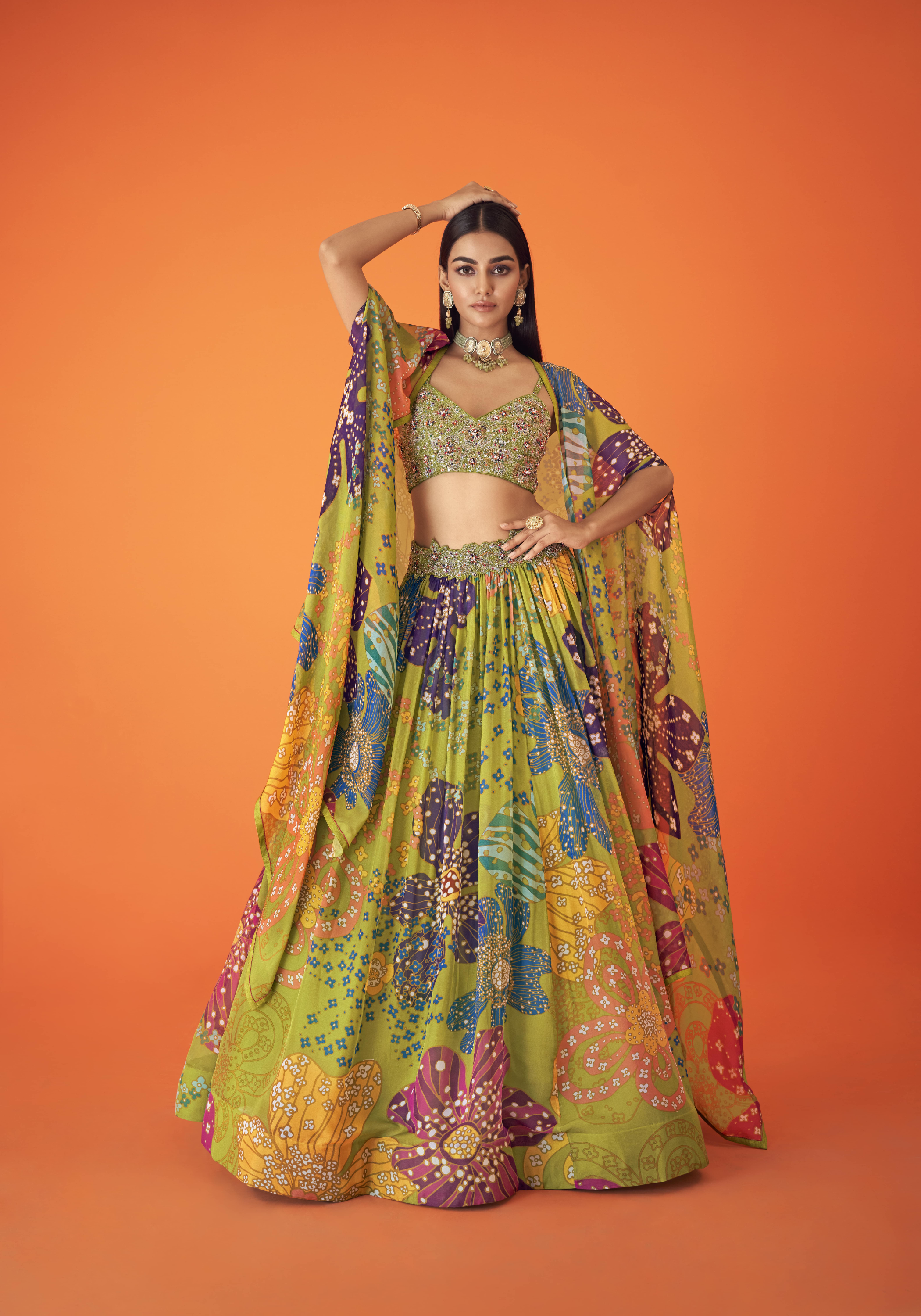 Green Printed Organza Waist Embellished Lehenga Paired With Embellished Bustier And Cape