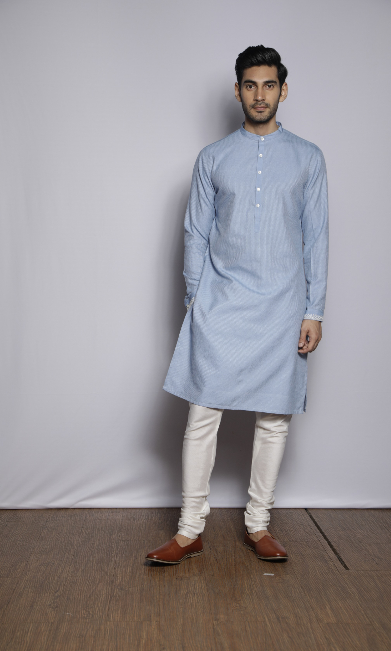 Powder blue kurta with front and sleeves self threading and emb on cuffs