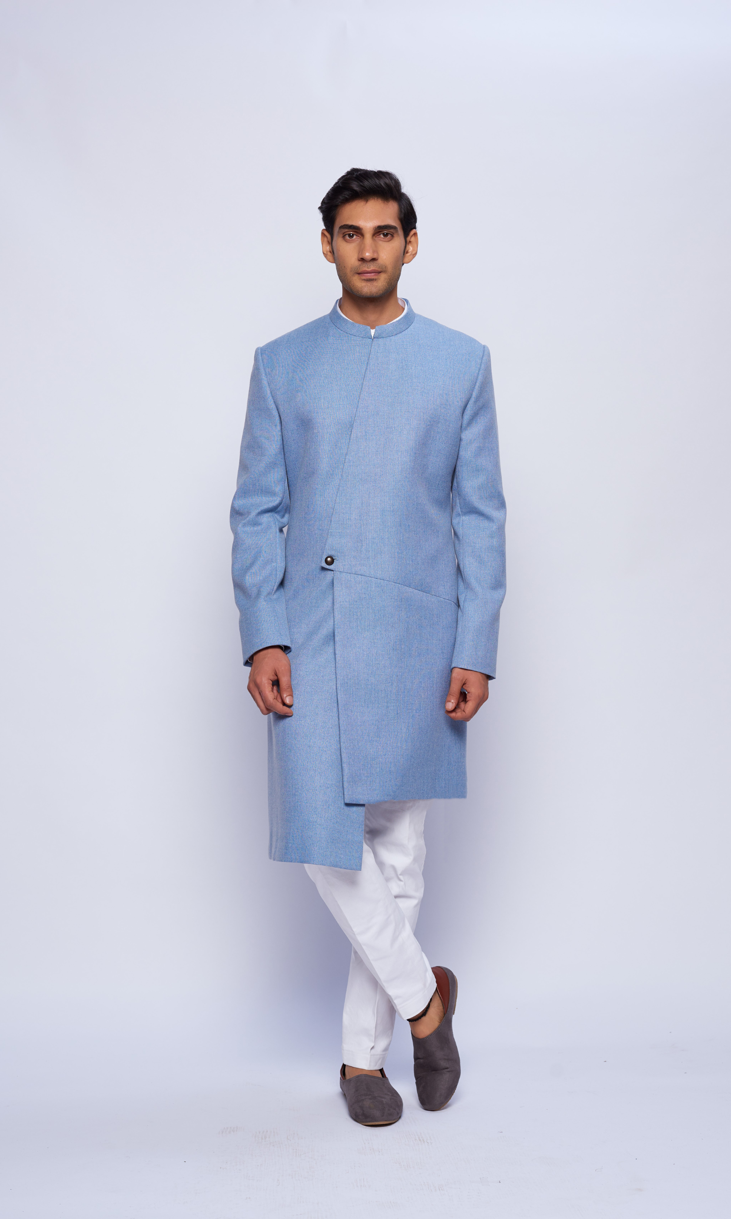 Powder blue  indowestern asymmetric yoke sherwani paired with   fitted pants