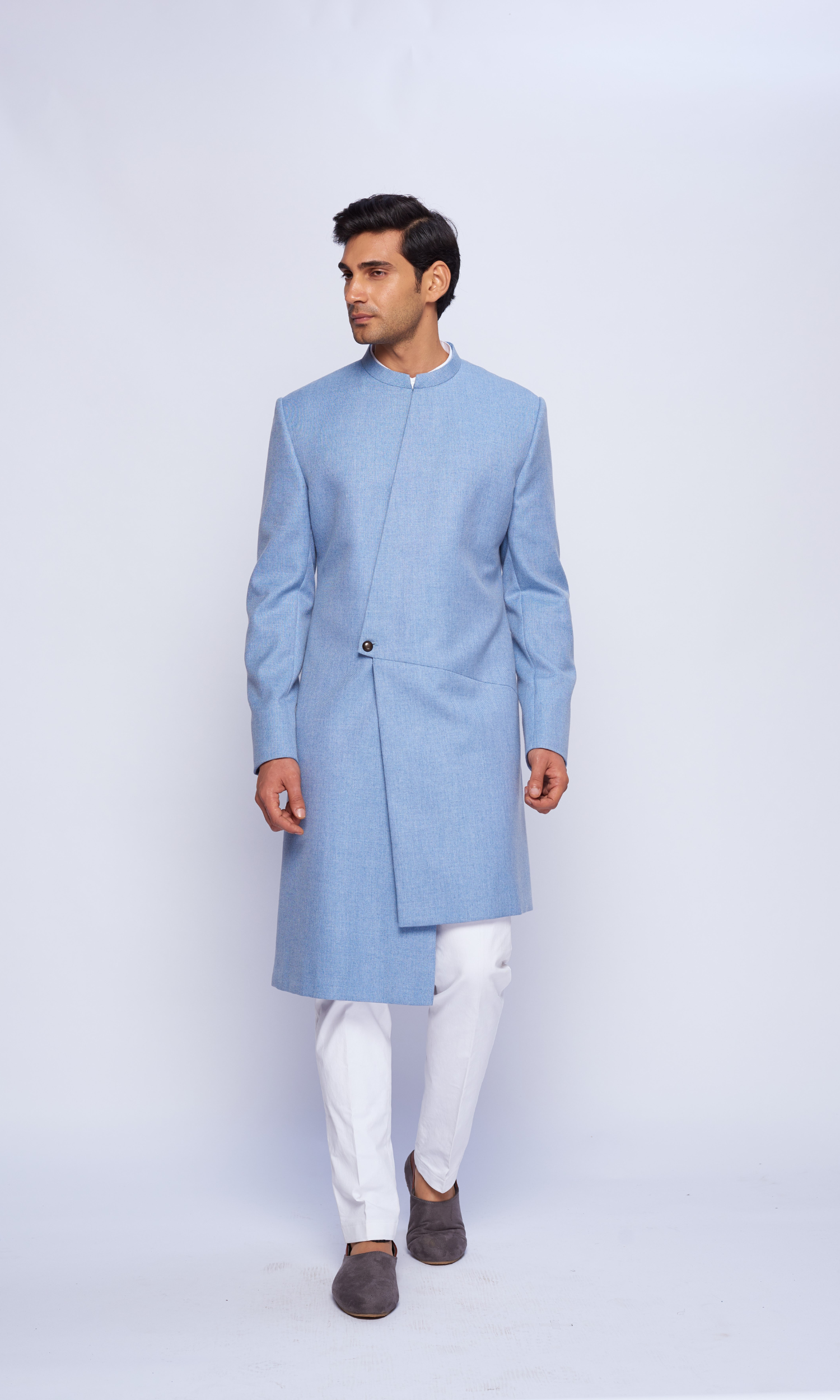 Powder blue  indowestern asymmetric yoke sherwani paired with   fitted pants