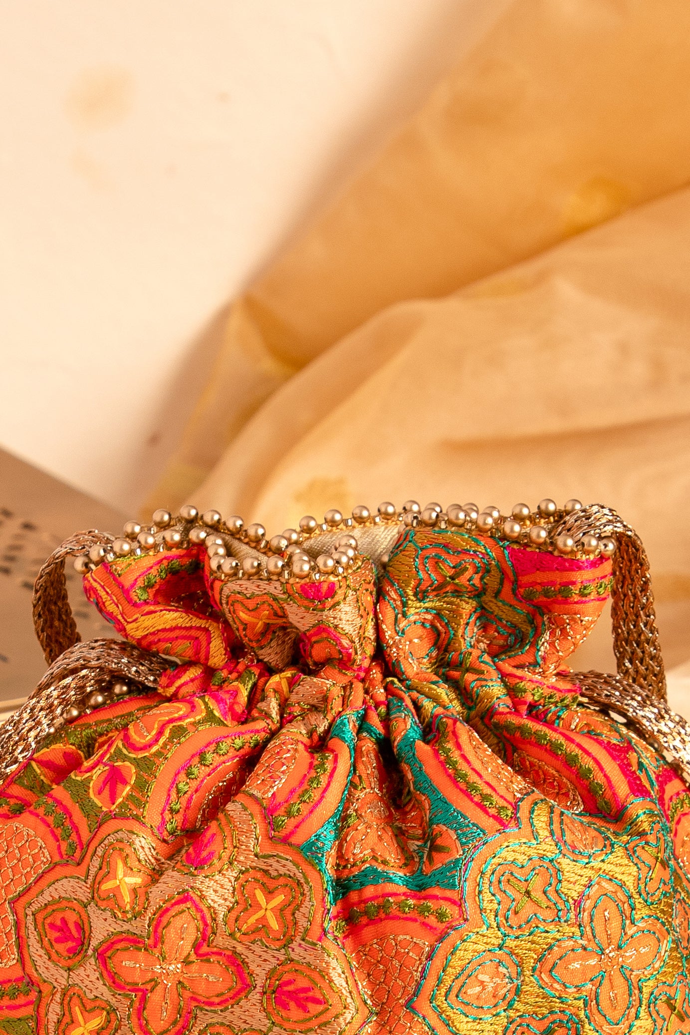 Amna Embroidered Potli Bag Orange