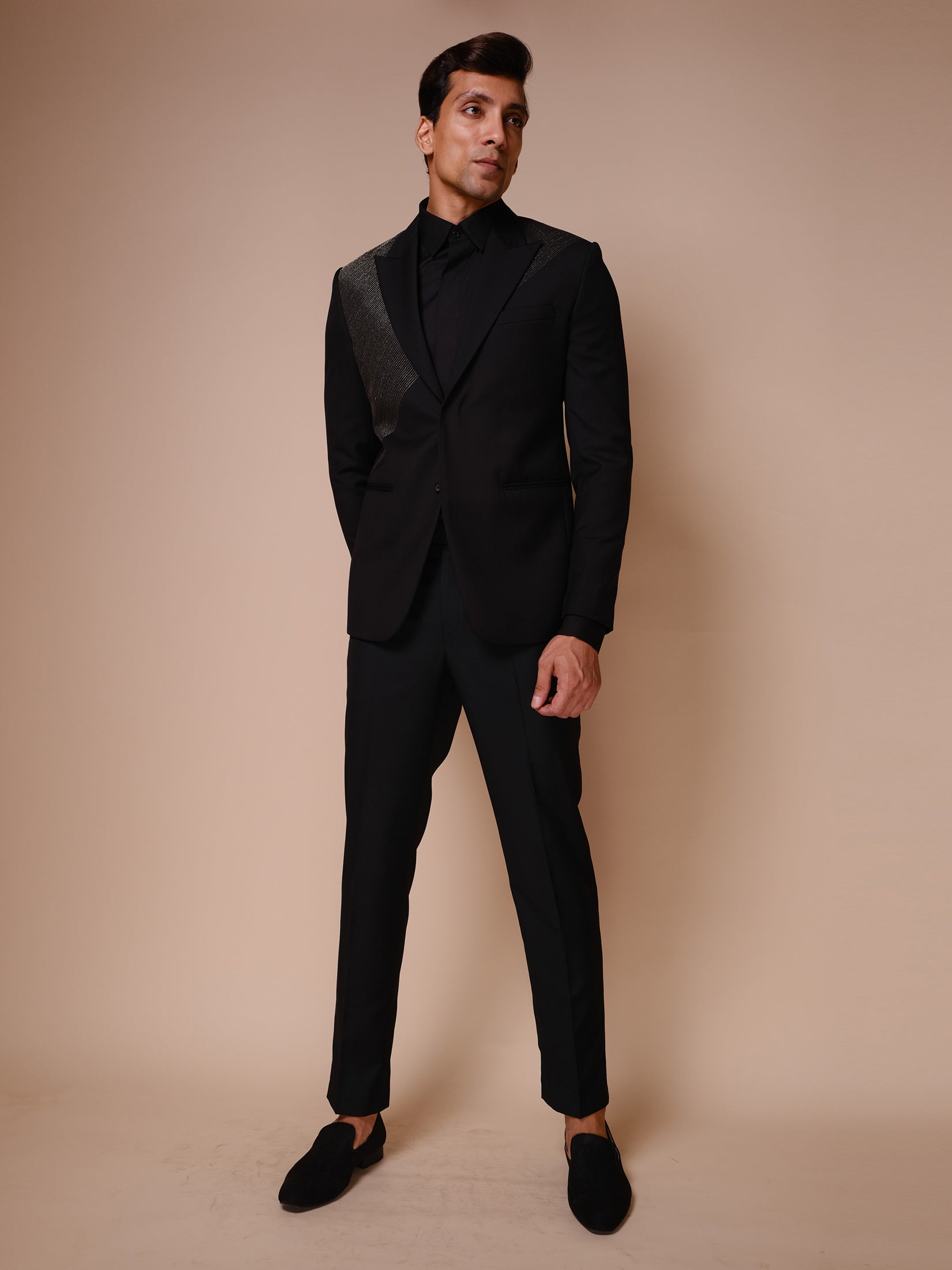 Black Peak Lapel Suit With Diagonal Gold Textured Lines Across Chest Paired With Trousers And Tonal Shirt