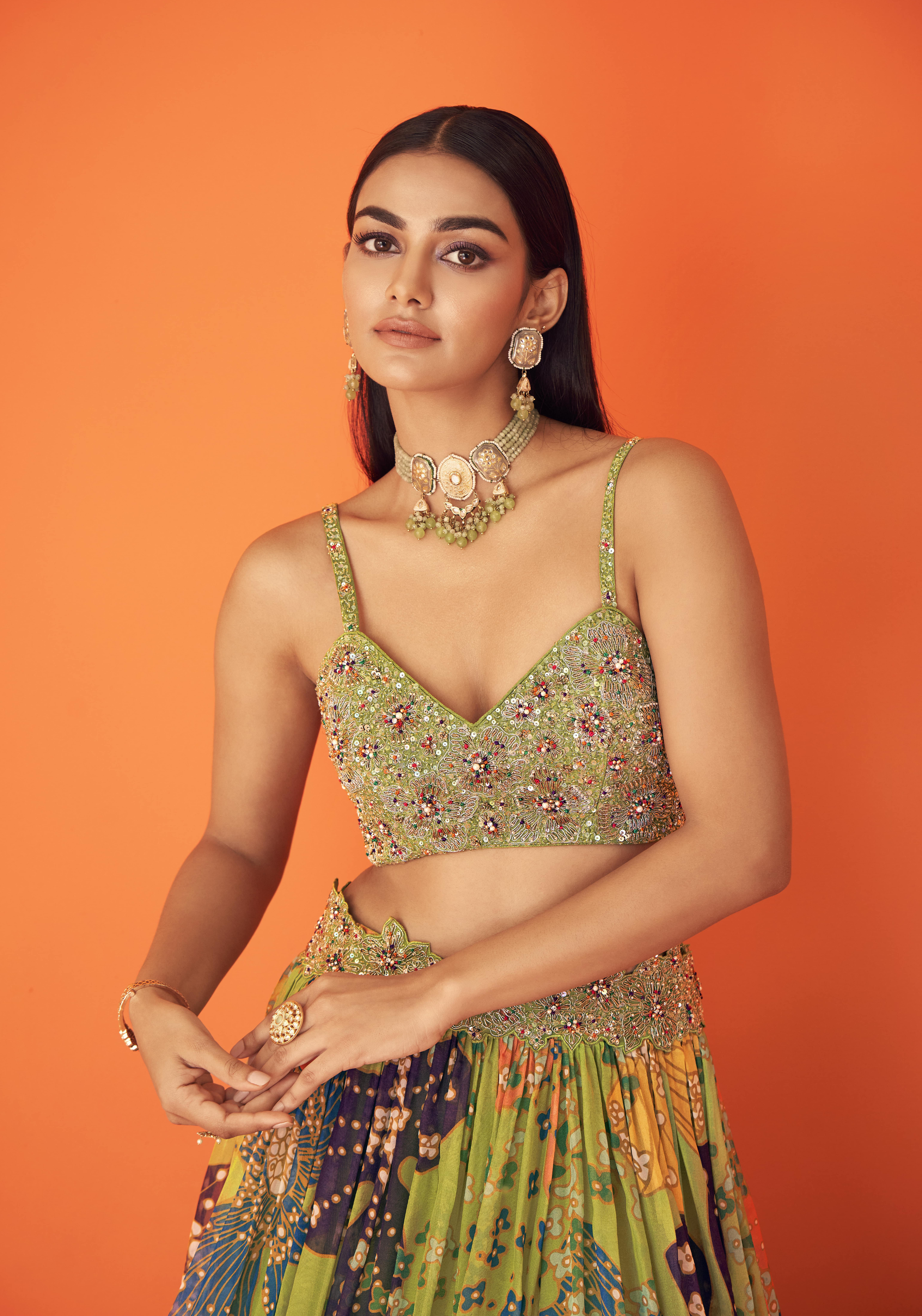 Green Printed Organza Waist Embellished Lehenga Paired With Embellished Bustier And Cape
