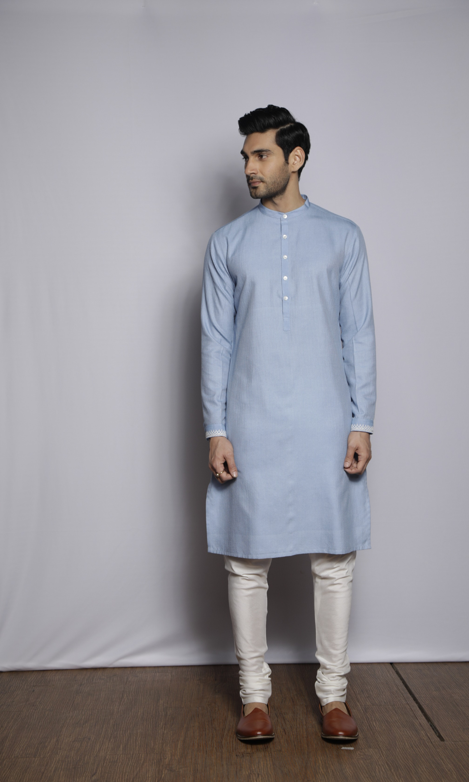 Powder blue kurta with front and sleeves self threading and emb on cuffs