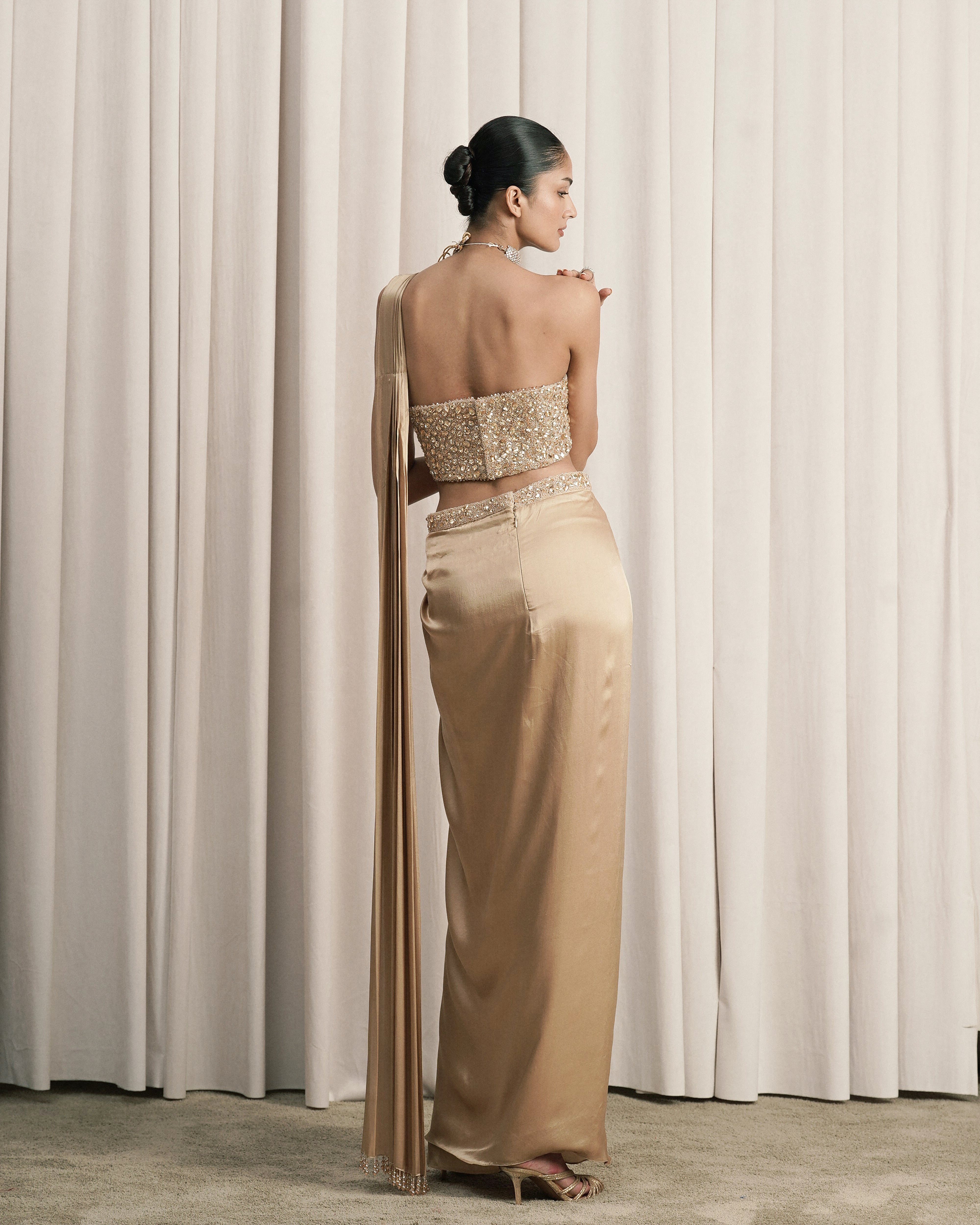 Beige Draped Saree With Embellished Corset