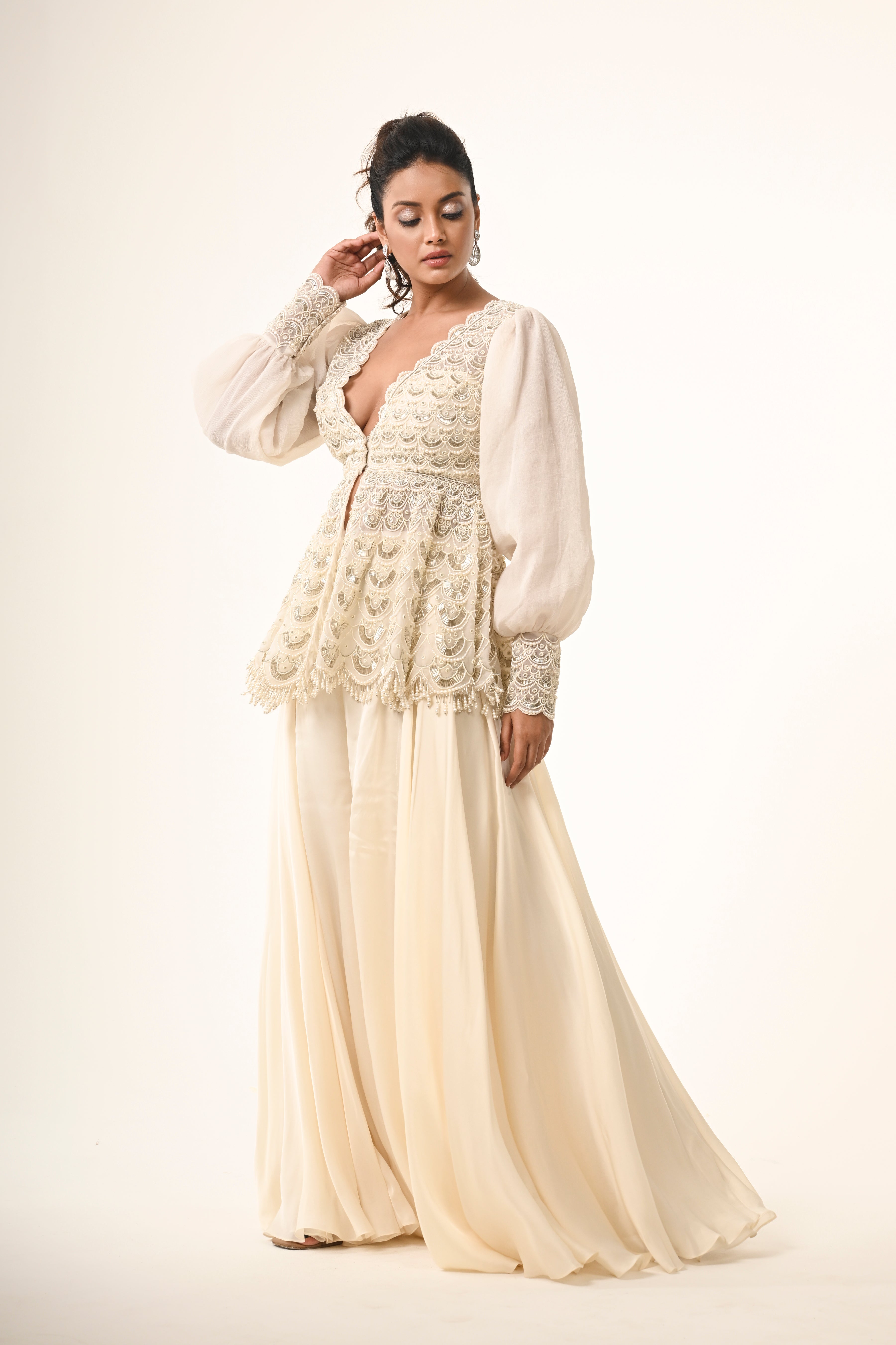 Ivory Peplum Top With Flared Pants