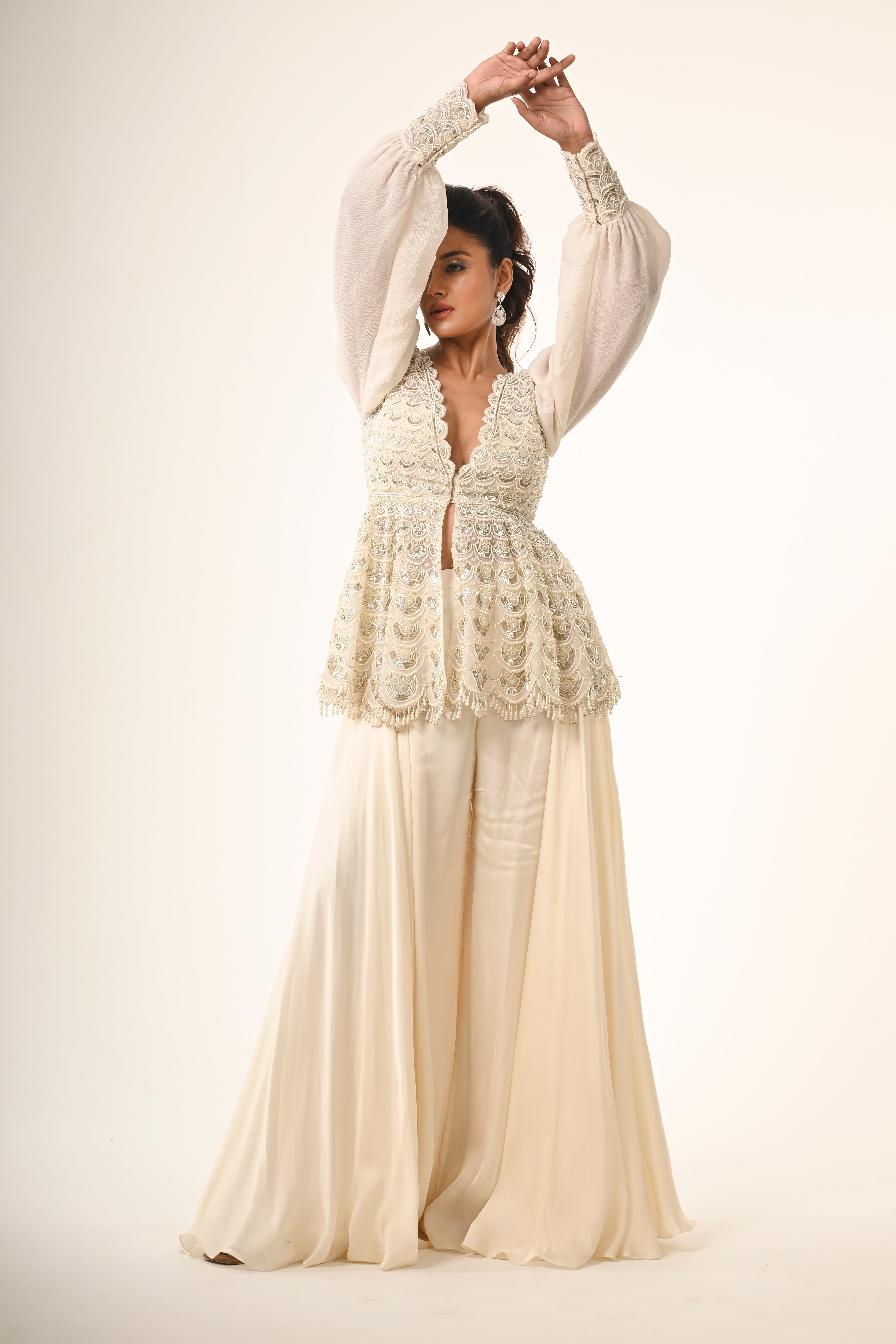 Ivory Peplum Top With Flared Pants