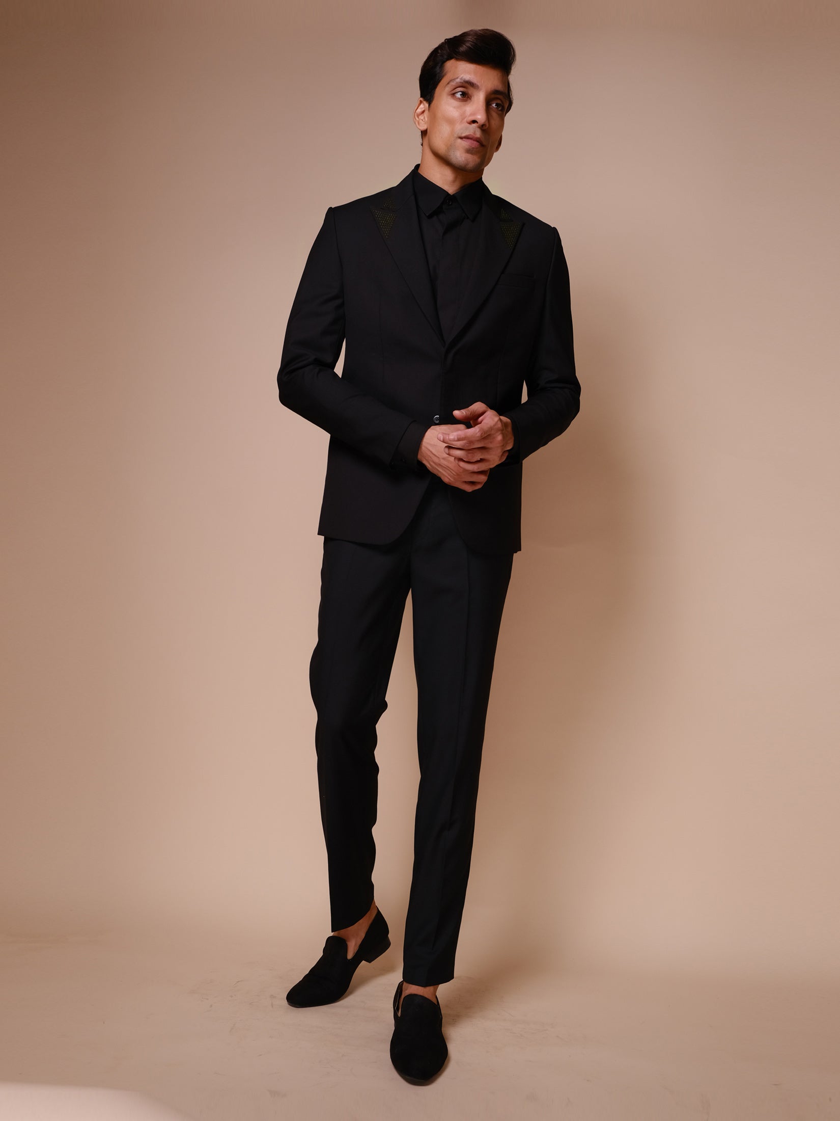 Black Suit With Inverted Embroidered Triangle On Lapel,flap Paired With Trousers And Tonal Shirt