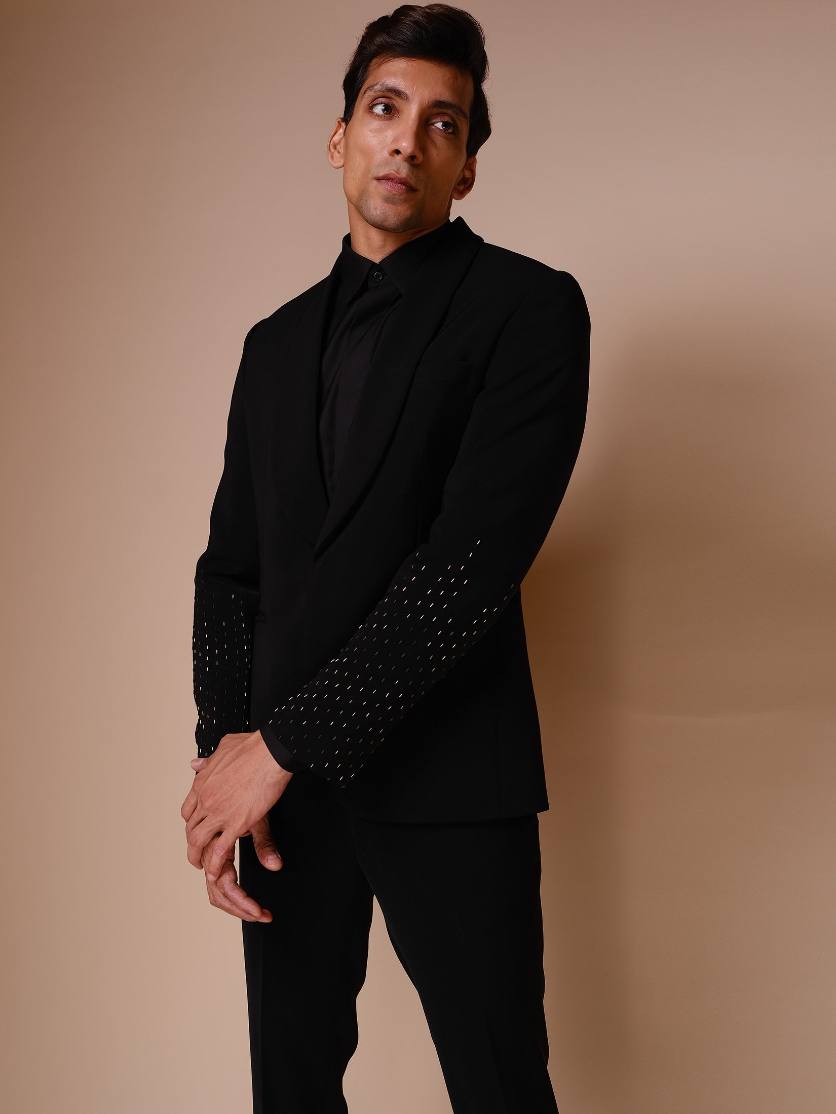 Black Shawl Lapel Tuxedo With Gold Embroidery On Sleeves Paired With Trousers And Tonal Shirt