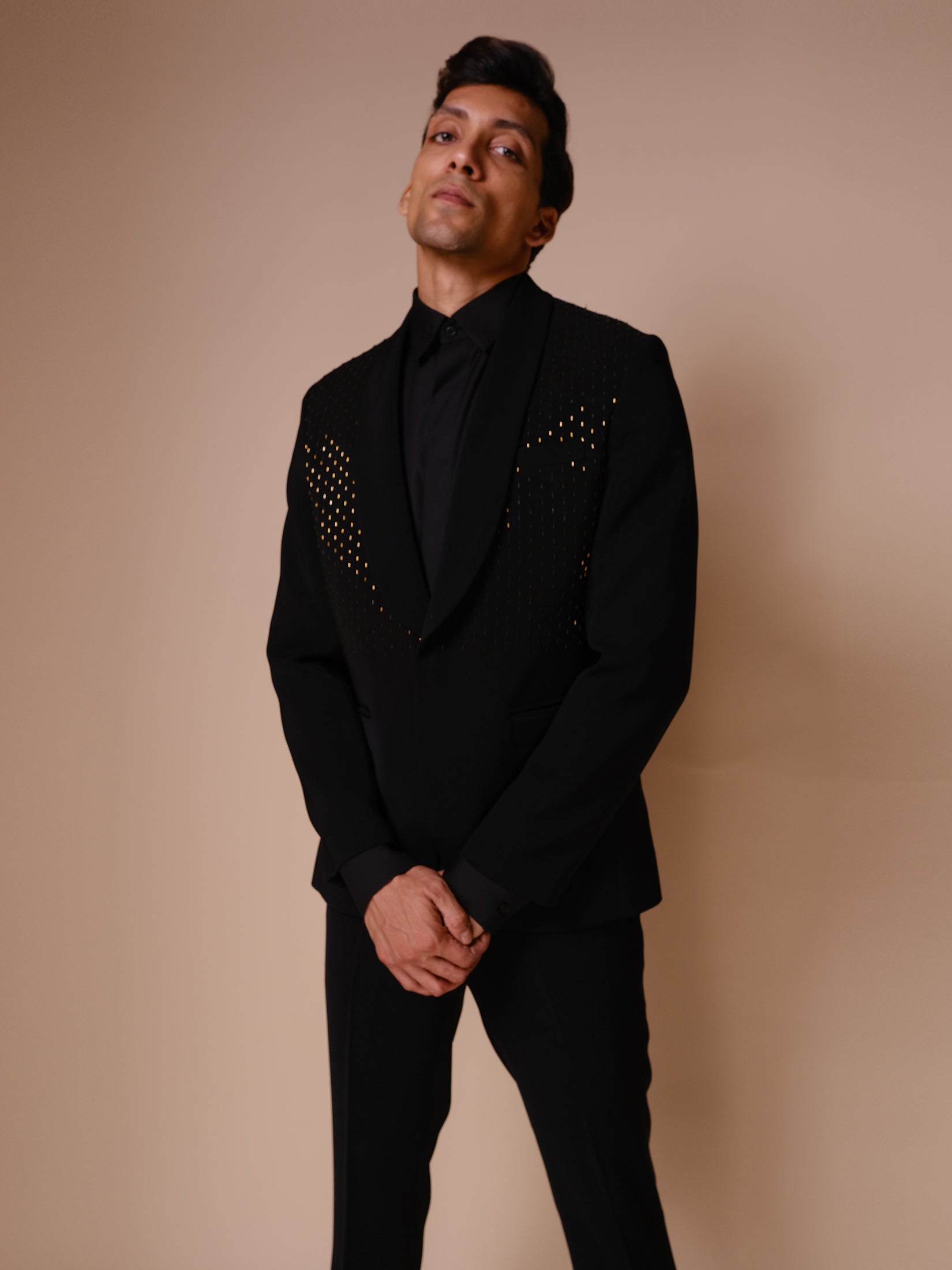 Black Shawl Lapel Tuxedo With Gold Embroidery Across Chest Paired With Trousers And Tonal Shirt