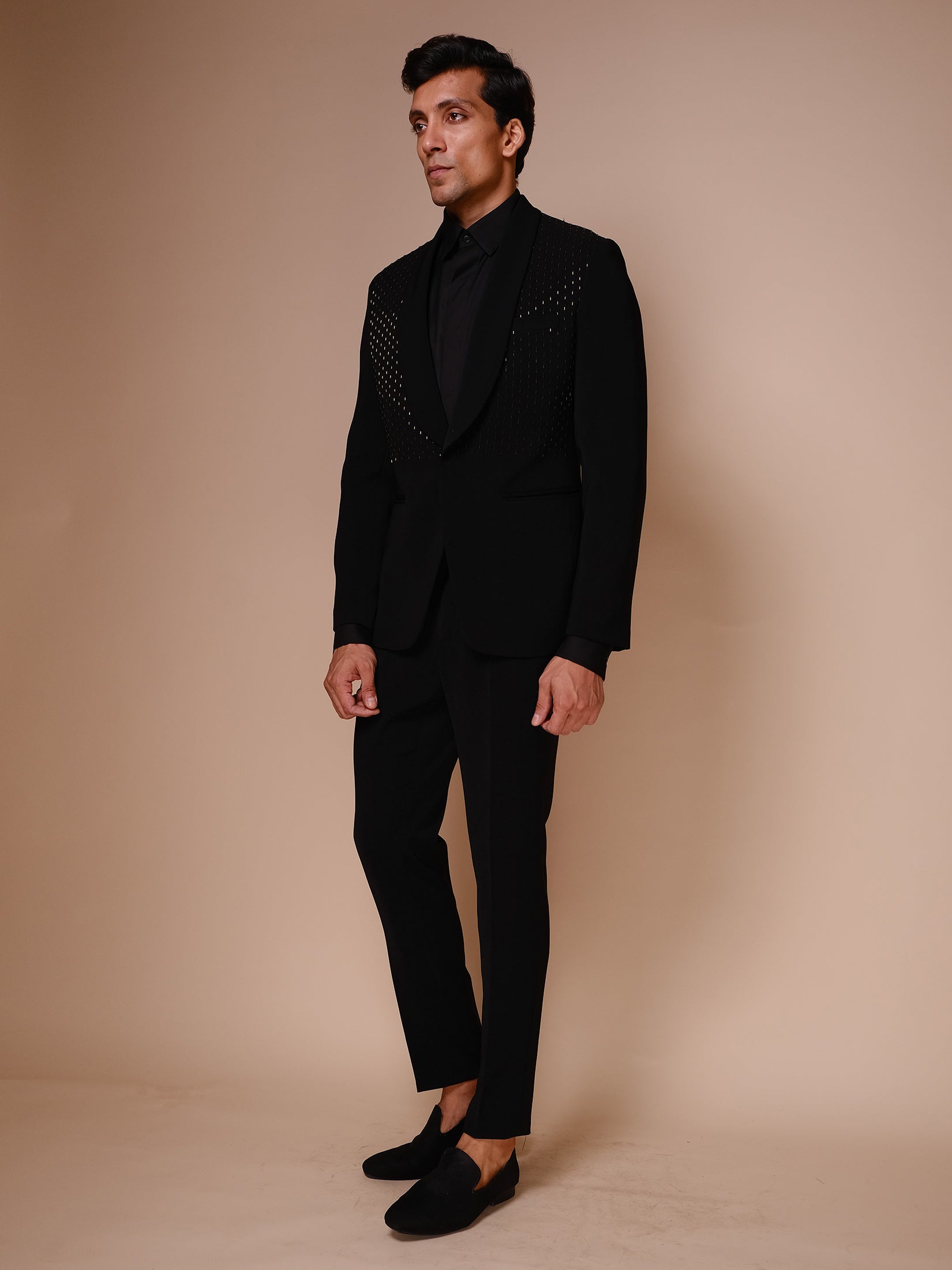 Black Shawl Lapel Tuxedo With Gold Embroidery Across Chest Paired With Trousers And Tonal Shirt