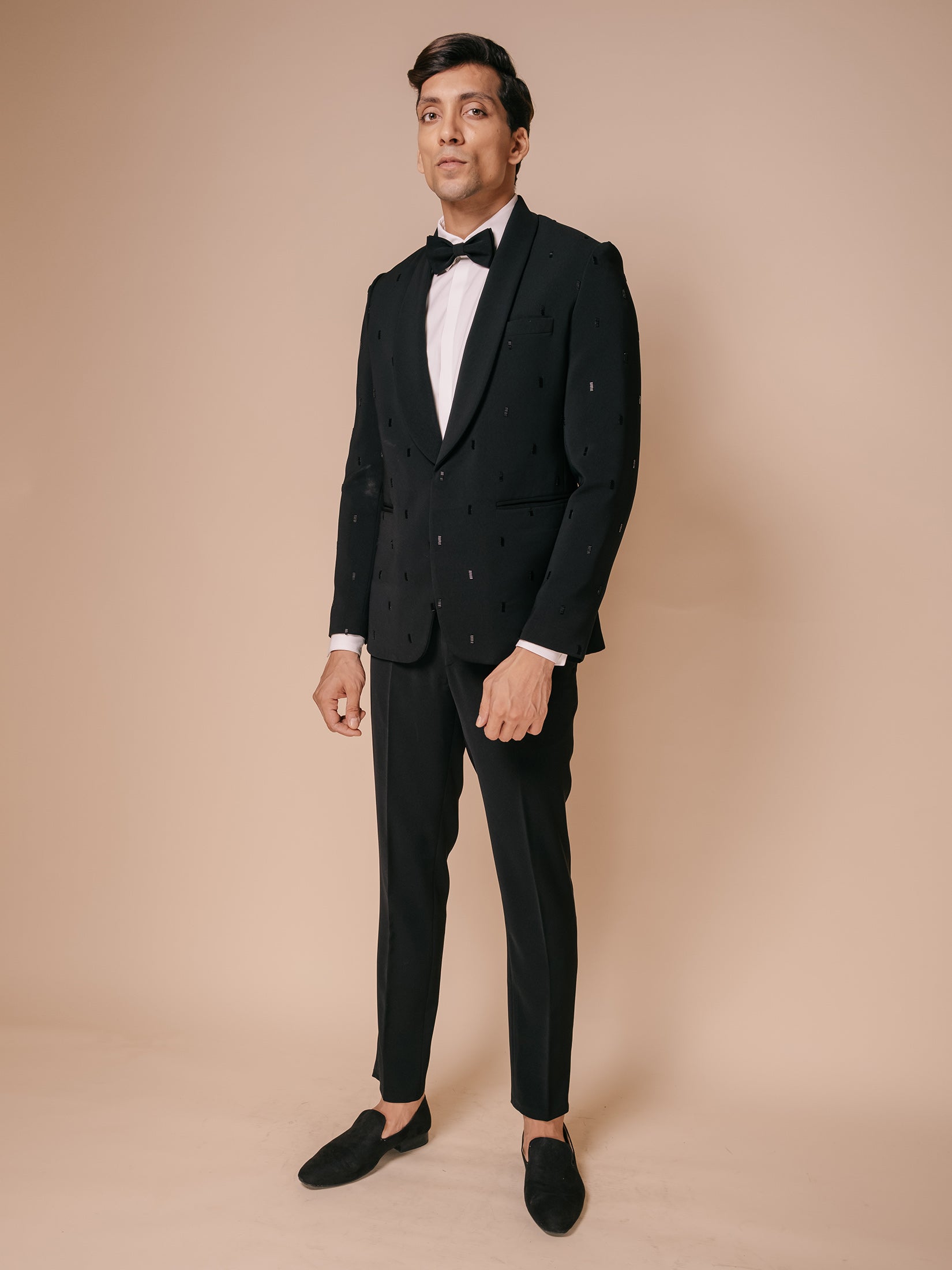 Black Shawl Lapel Tuxedo With All Over Stack Motifs Paired With Trousers And Tonal Shirt